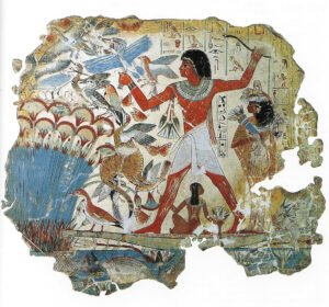 Nebuman and his wife. A bunch of lotus flowers hang over his arm and another spray is held by his wife.