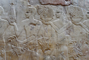 Bearers with offerings such as lotus flowers.